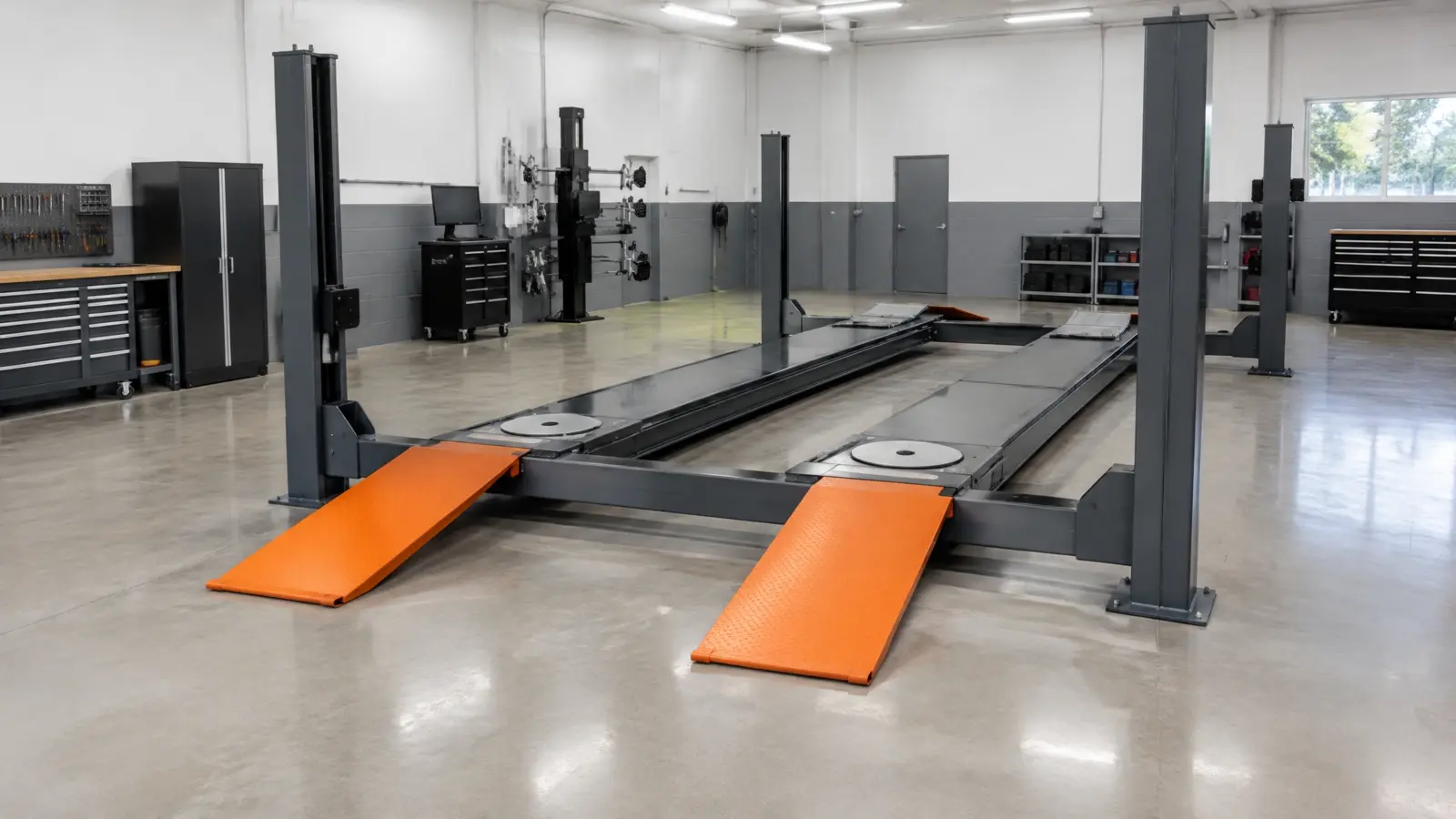 4 post alignment lift in a shop bay showing wider overall width
